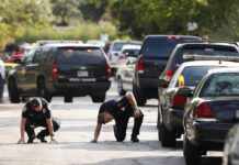 policía investigan la escena del crimen de un tiroteo EFE