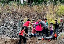 Migrantes derriban a la Guardia Nacional y el cerco de púas en la frontera de México-EEUU